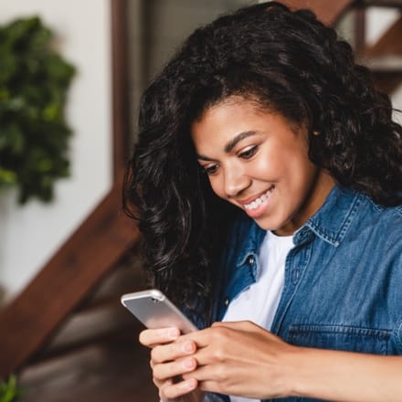 A young woman using a smartphone.