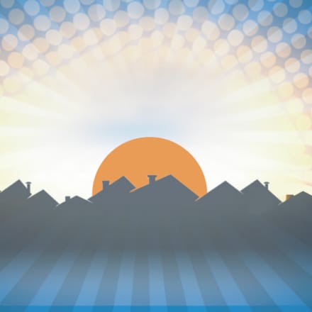 An illustration of a sunrise against a skyline.