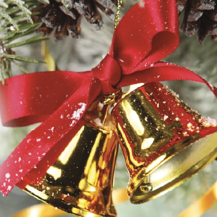 Two gold bells with a red ribbon.
