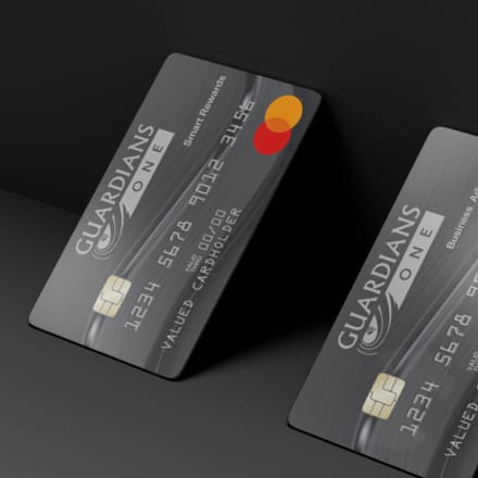 Two Guardians credit cards standing at an angle.