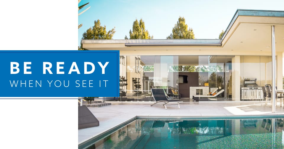 The outdoor patio of a modern home. At the left, the words: be ready when you see it.