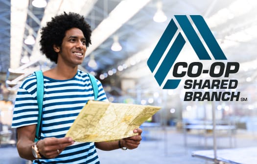 A man wearing a backpack holding a map with the CO-OP Shared Branch logo to the right