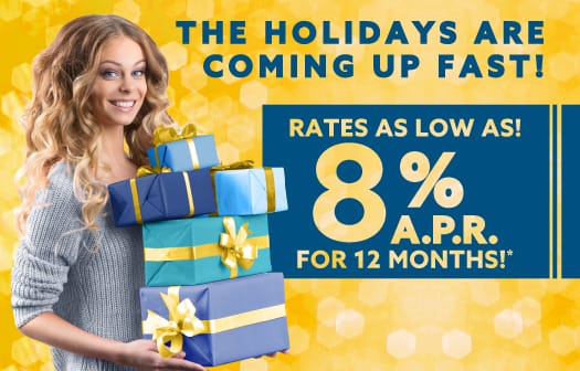 A woman holding gifts to the left of the words: The Holidays are coming up fast! Rates as low as 8% APR for 12 months!