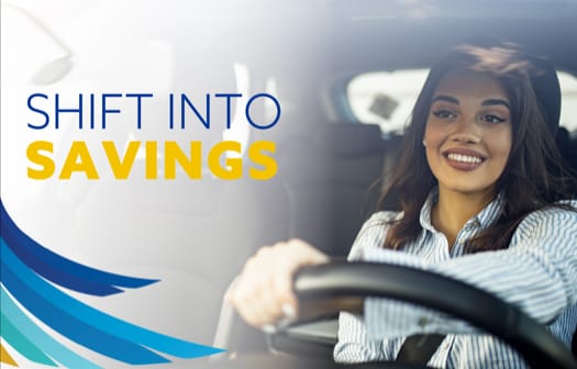 A young woman smiling while driving a car. At the top left, the words: Shift into savings.