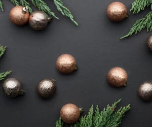 Holiday ornaments resting on a table.