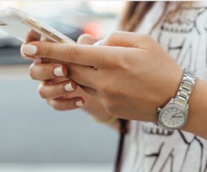 A young woman using a smart phone.