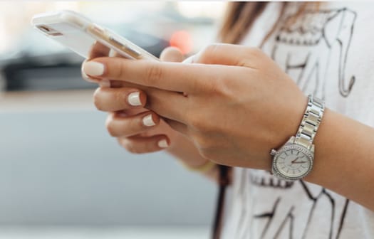 A young woman using a smart phone.