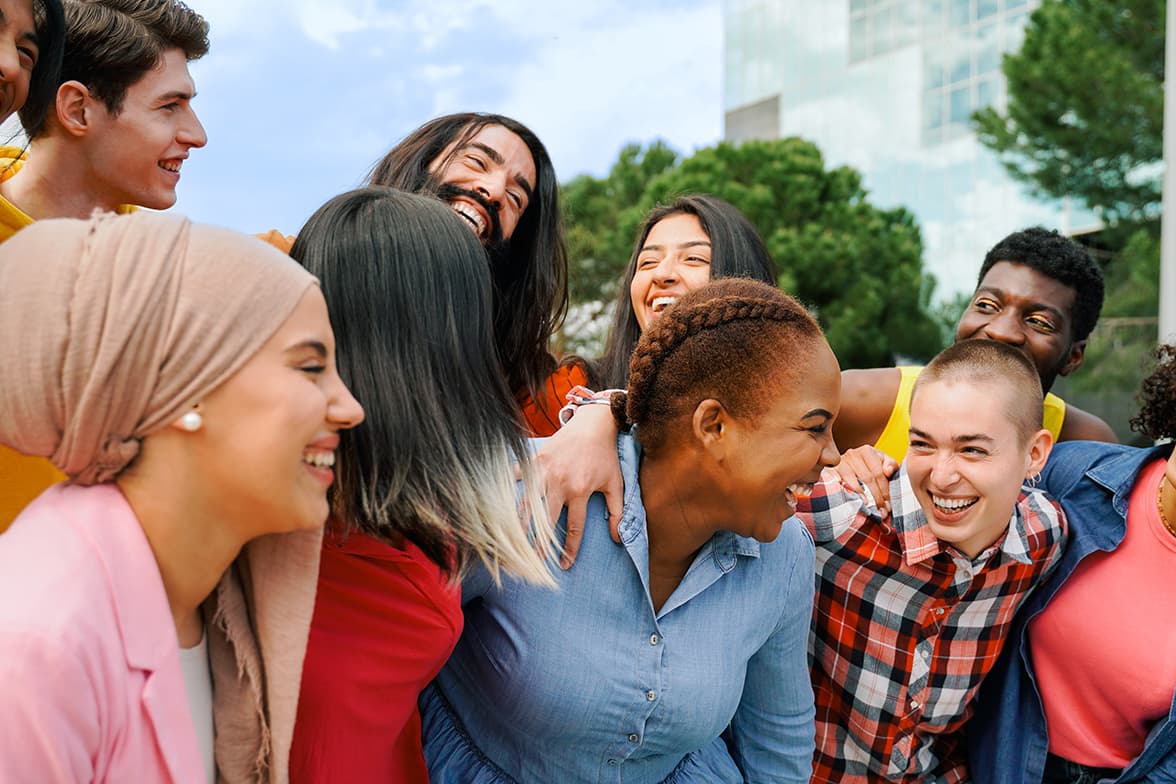A group of diverse people in a group hug.