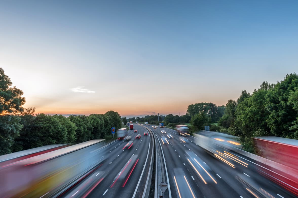 A light trail photograph of a highway.