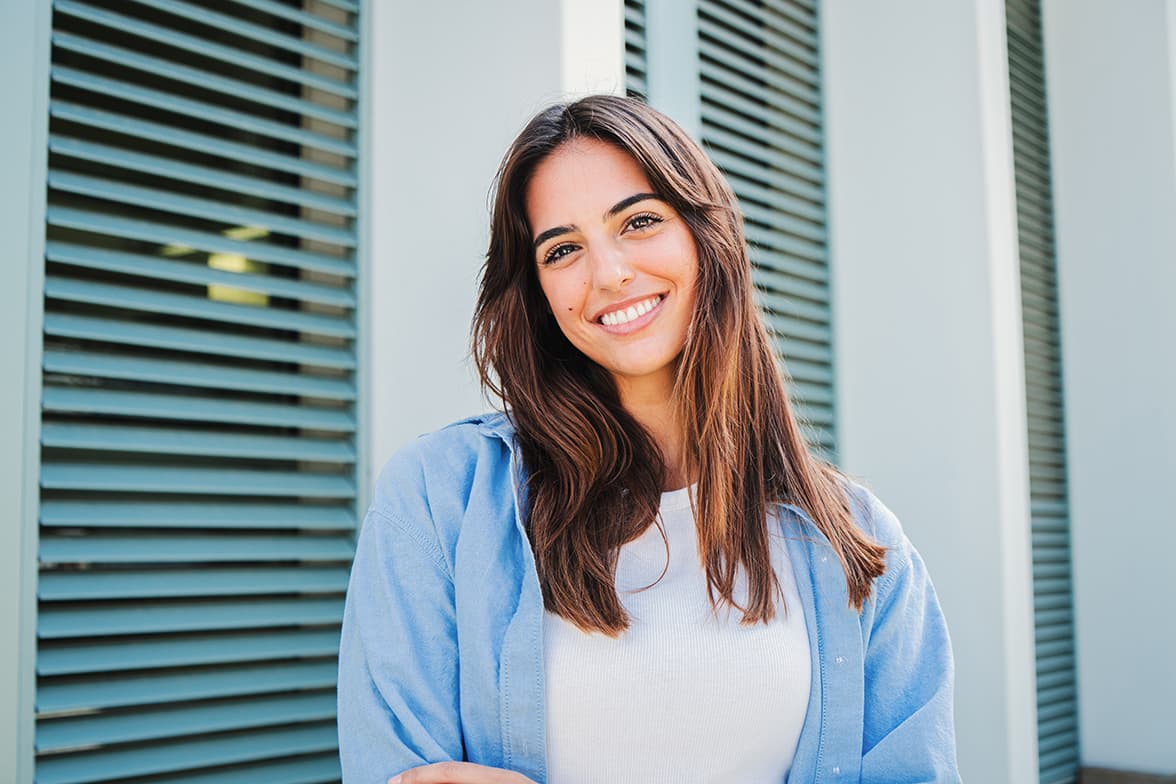 A smiling, young woman.