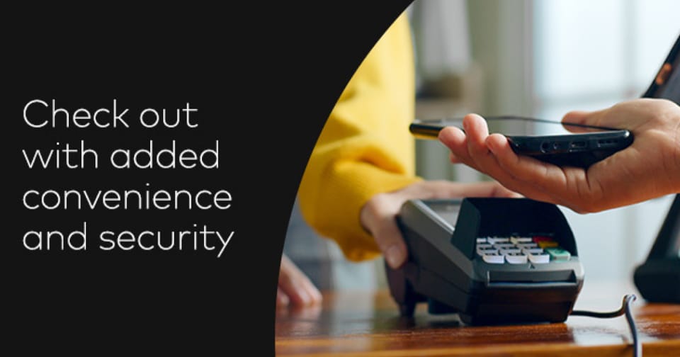 A hand holding the new Mastercard debit card surrounded by confetti.