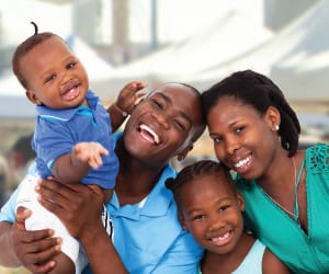 A family of two smiling